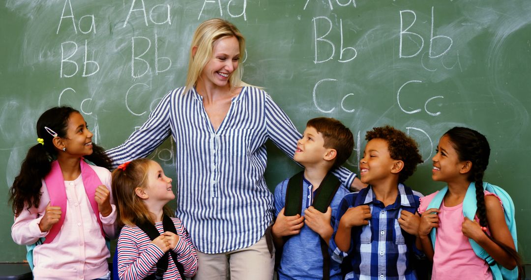 Smiling Teacher Engaging with Class of Diverse Young Students