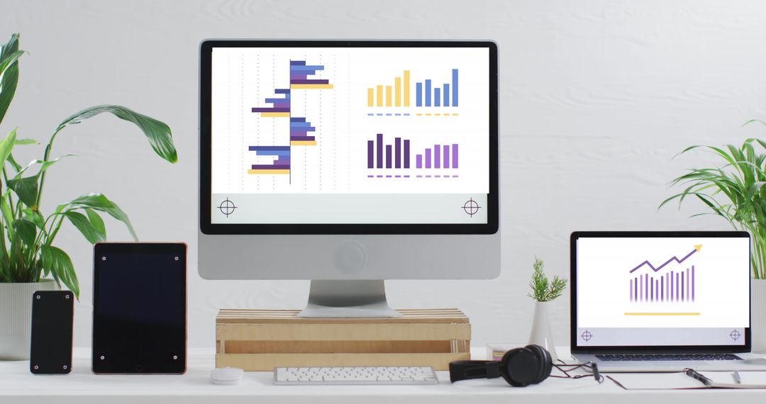 Modern Workstation with Financial Charts and Graphs on Screens