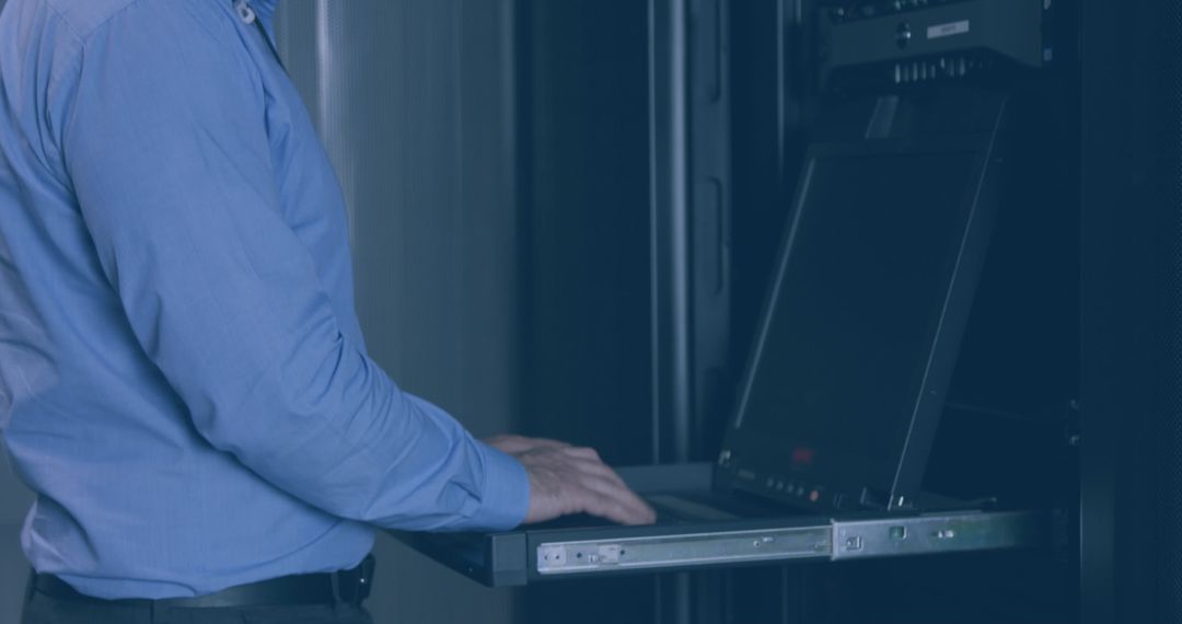 Technician Ensuring System Performance in Modern Data Center