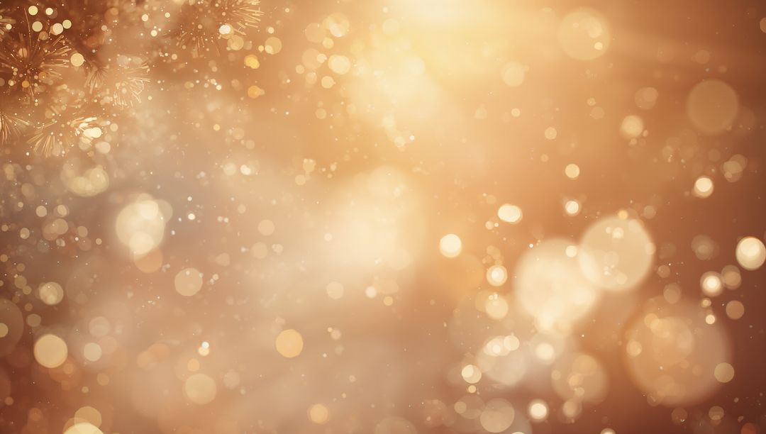 Shimmering golden bokeh lights sparkling with warm glitter and soft snowflake glow