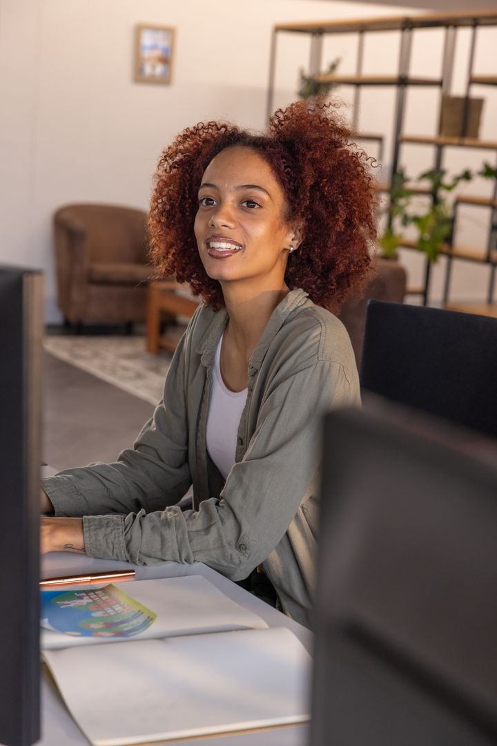 Professional Woman Enthusiastically Engaged in Office Work