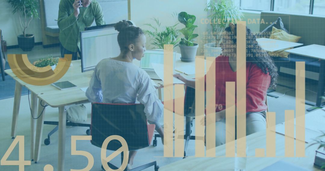 Diverse Team Collaborating with Data Visuals in Modern Office