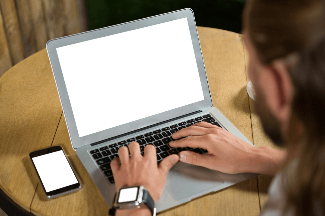 Man Using Laptop with Transparent Screen at Café Table