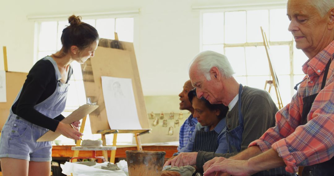 Diverse Group in Pottery Class Engaging in Creative Learning