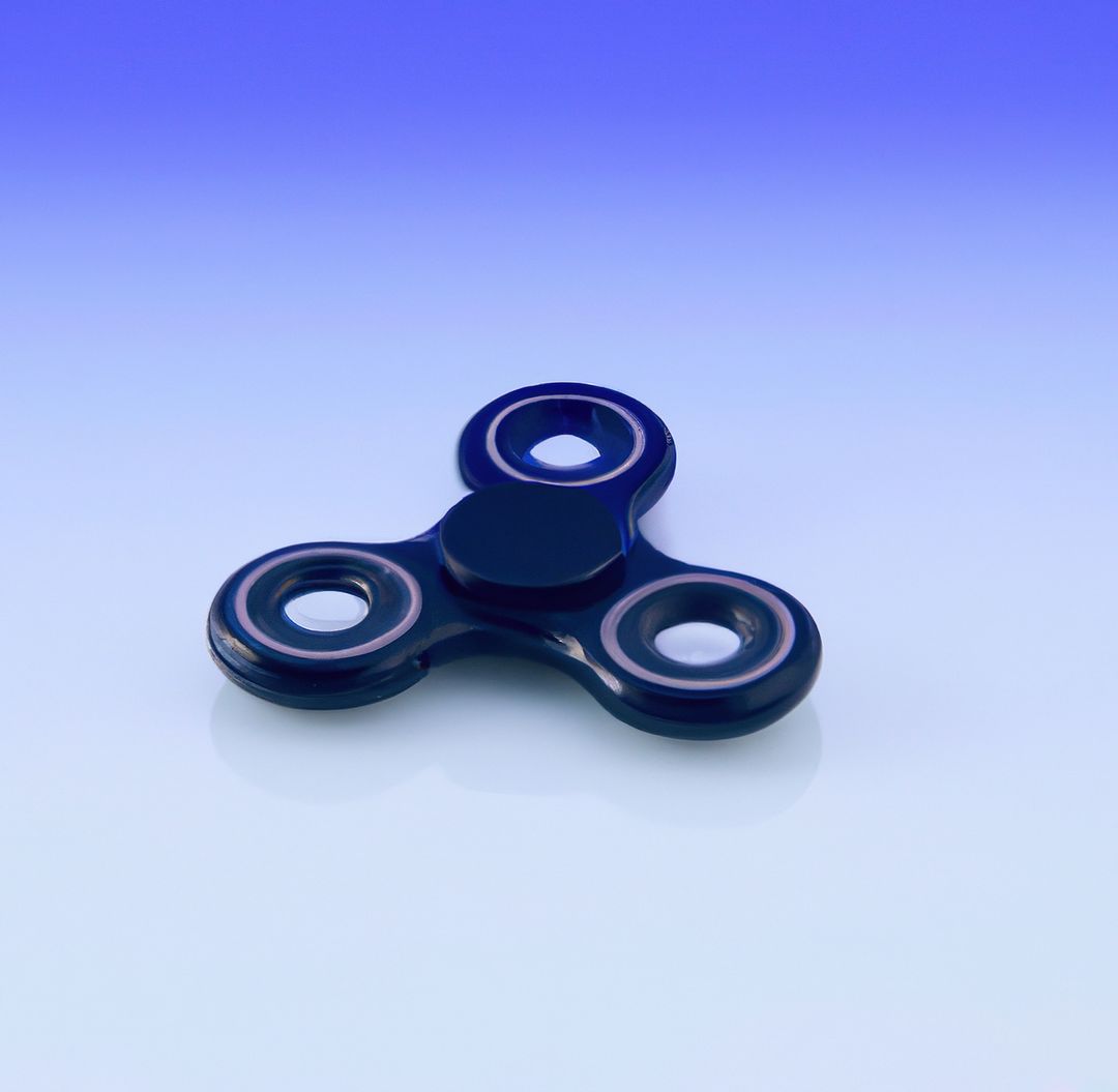 Image of black and purple fidget spinner on purple background - Free Images, Stock Photos and Pictures on Pikwizard.com