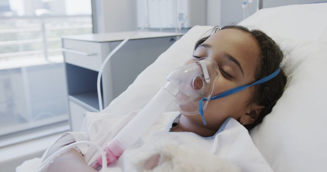 Young Girl Sleeping in Hospital Bed with Oxygen Mask - Free Images, Stock Photos and Pictures on Pikwizard.com