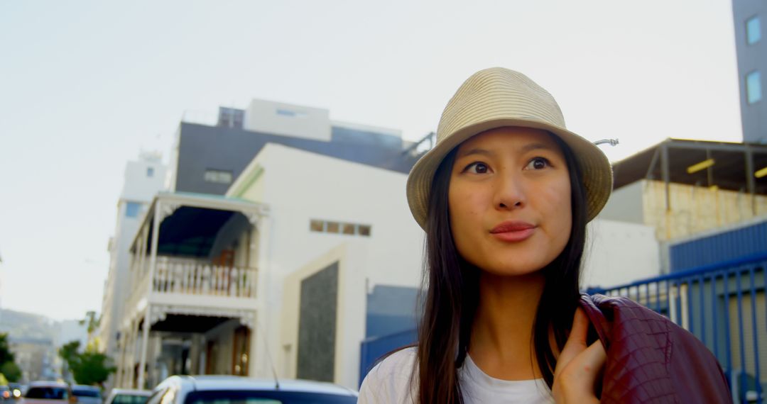 Young Woman Wearing Hat in Urban Street - Free Images, Stock Photos and Pictures on Pikwizard.com