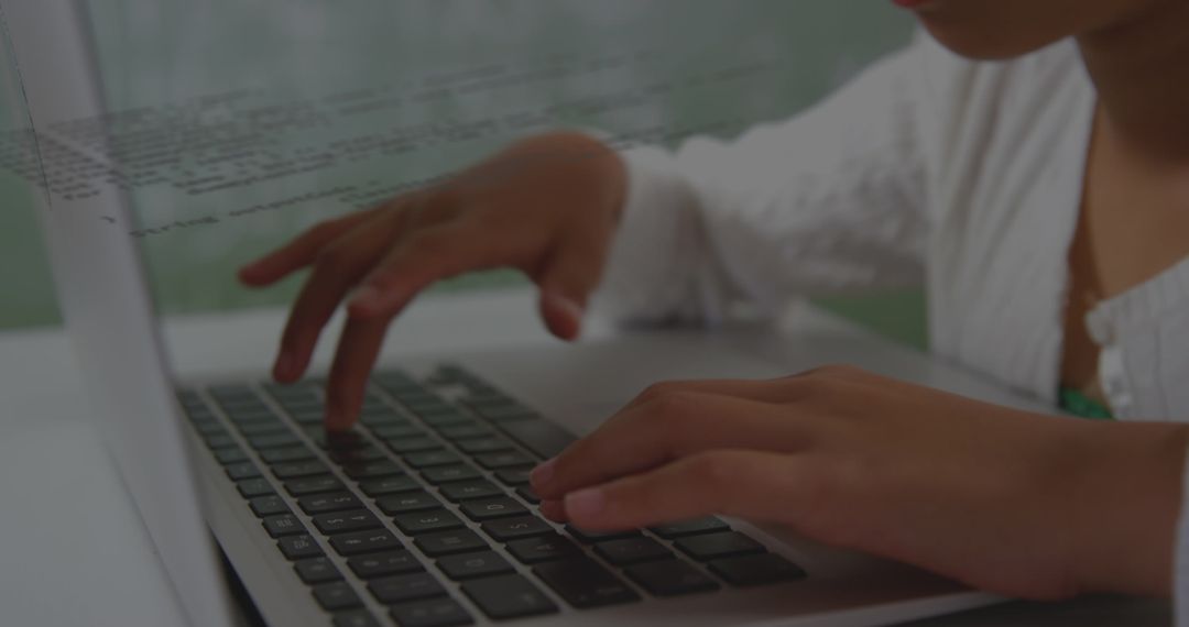 Asian Girl Engaging in Data Processing on Laptop