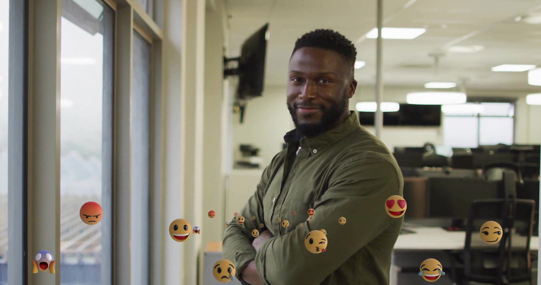 Confident Employee in Modern Office with Digital Interaction Emojis