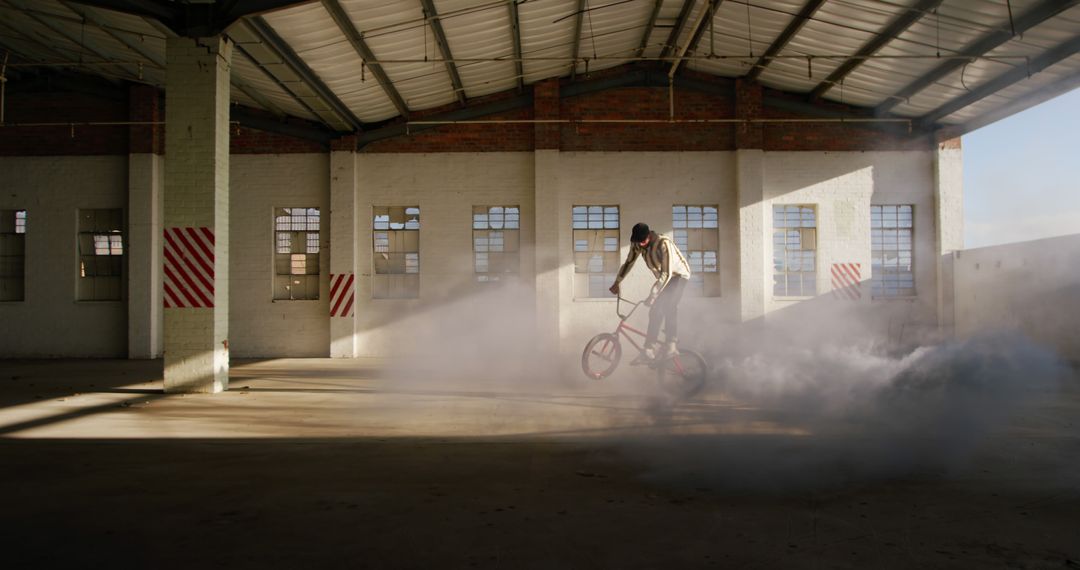 Thrilling BMX Trick in Abandoned Dusty Warehouse