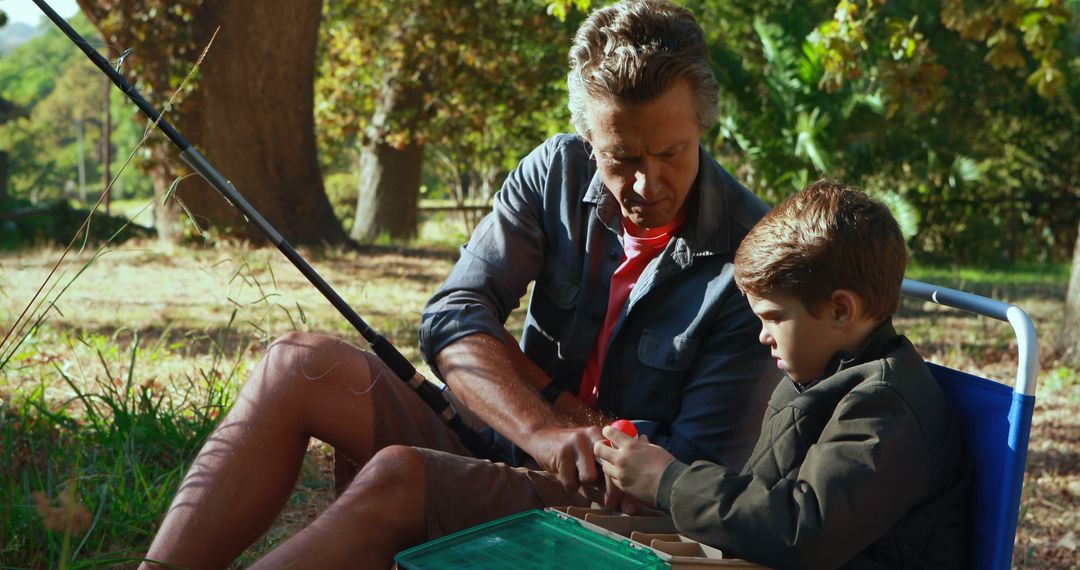 Father Teaching Son to Fish in Peaceful Forest Setting - Free Images, Stock Photos and Pictures on Pikwizard.com