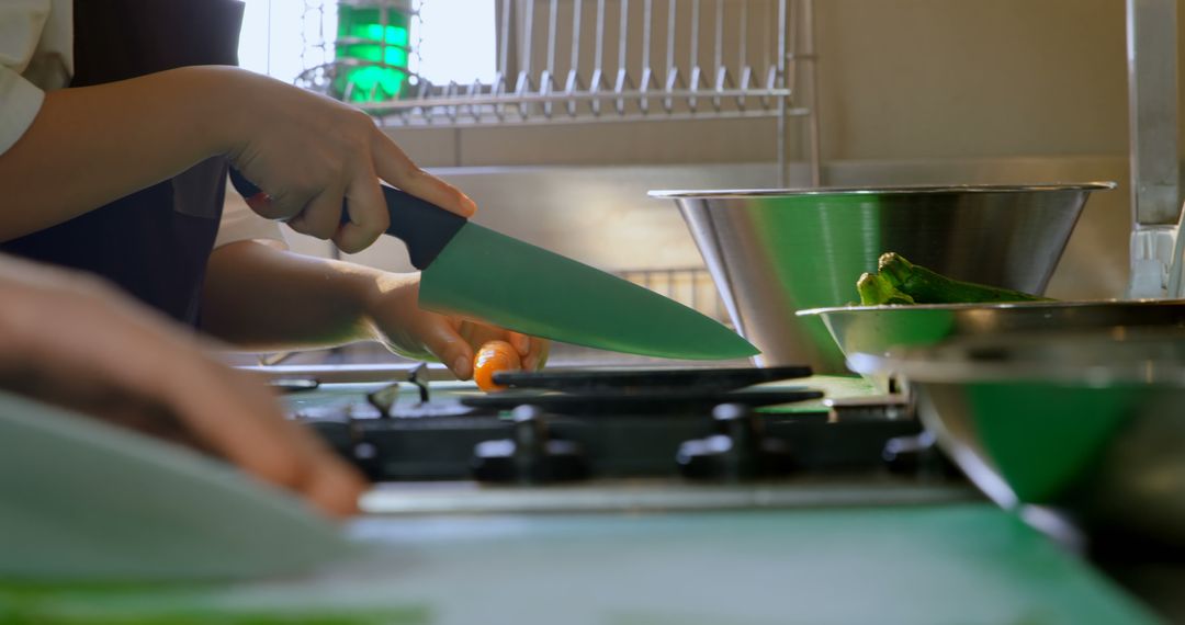 Chef Demonstrating Precise Knife Skills in Modern Kitchen