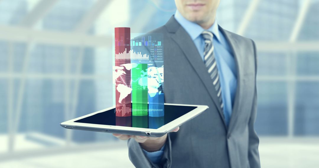 Businessman Holding Tablet with Virtual Data Visualization - Free Images, Stock Photos and Pictures on Pikwizard.com