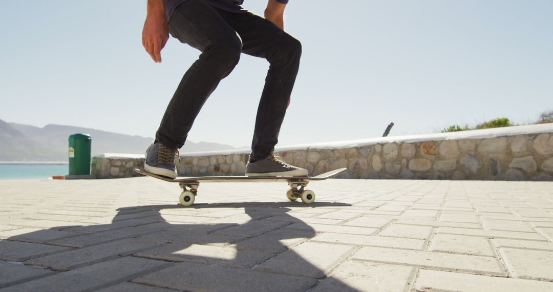 Skateboarder Performing Tricks at Seaside Park - Free Images, Stock Photos and Pictures on Pikwizard.com