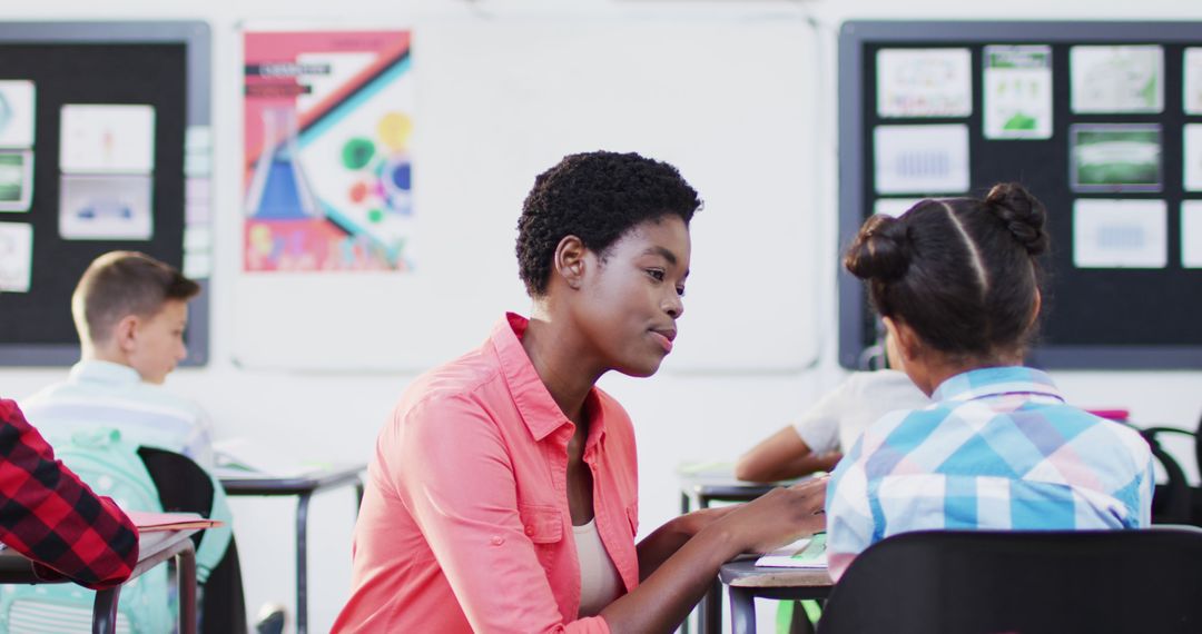 Teacher Guiding Student in Inclusive Classroom Environment