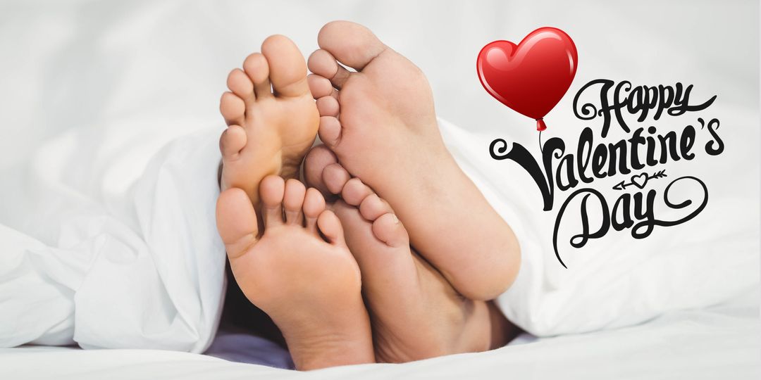 Feet Under Sheets with Valentine's Day Greeting Balloon
