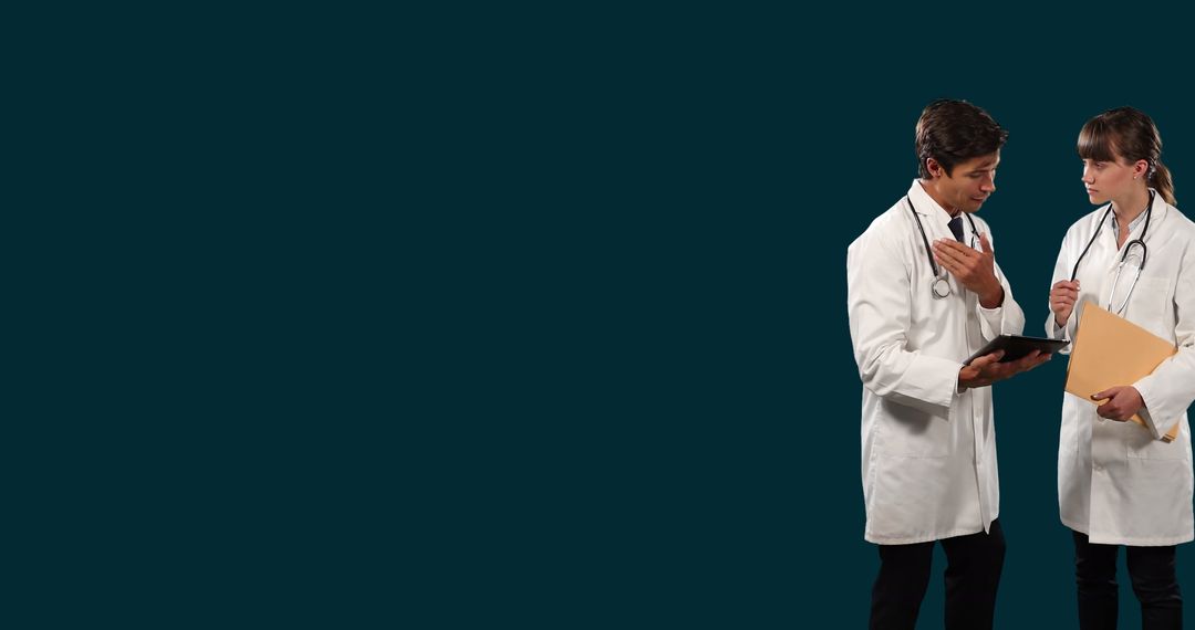 Doctors Discussing Patient Reports on Digital Tablet