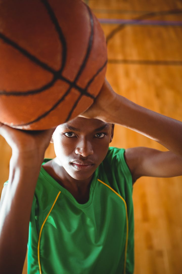 Portrait of teenage boy with basketball - Free Images, Stock Photos and Pictures on Pikwizard.com
