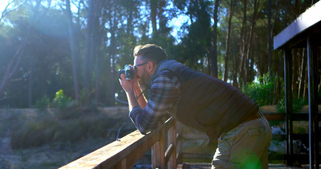 Man Photographing Scenic Outdoors in Nature Reserve - Free Images, Stock Photos and Pictures on Pikwizard.com