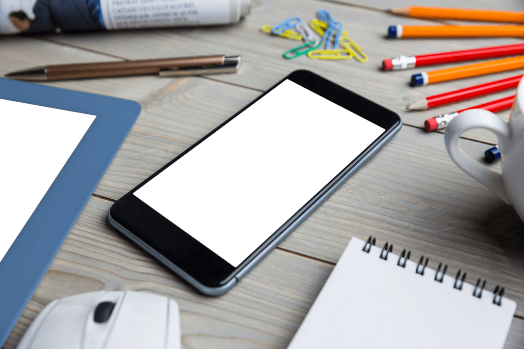 Transparent Electronics and Stationery on Wooden Desk