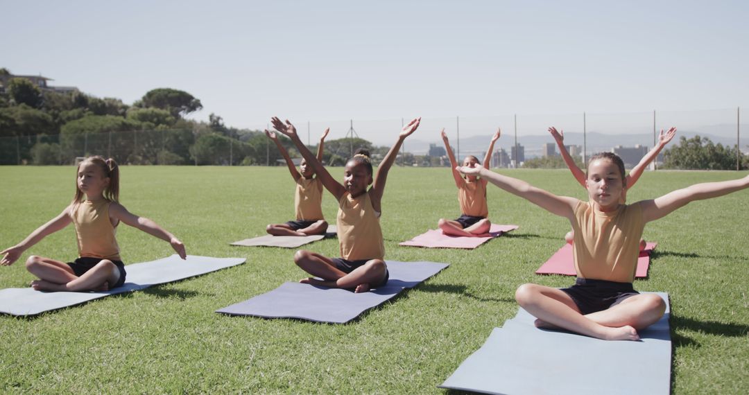 Group of Children Practicing Yoga Outdoors on Sunny Day - Free Images, Stock Photos and Pictures on Pikwizard.com