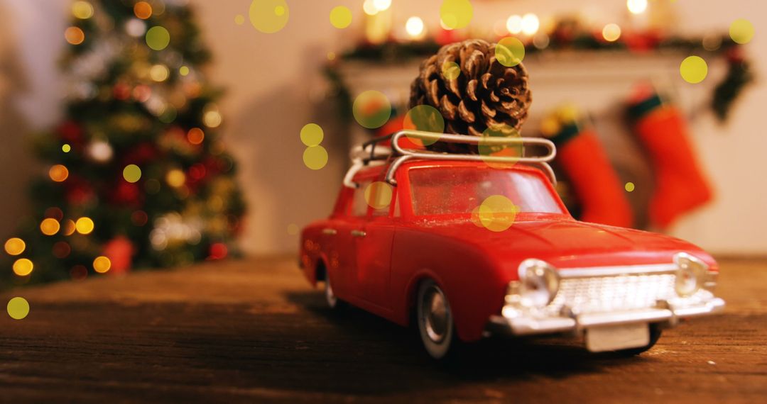 Festive red toy car with pine cone amid christmas ambience