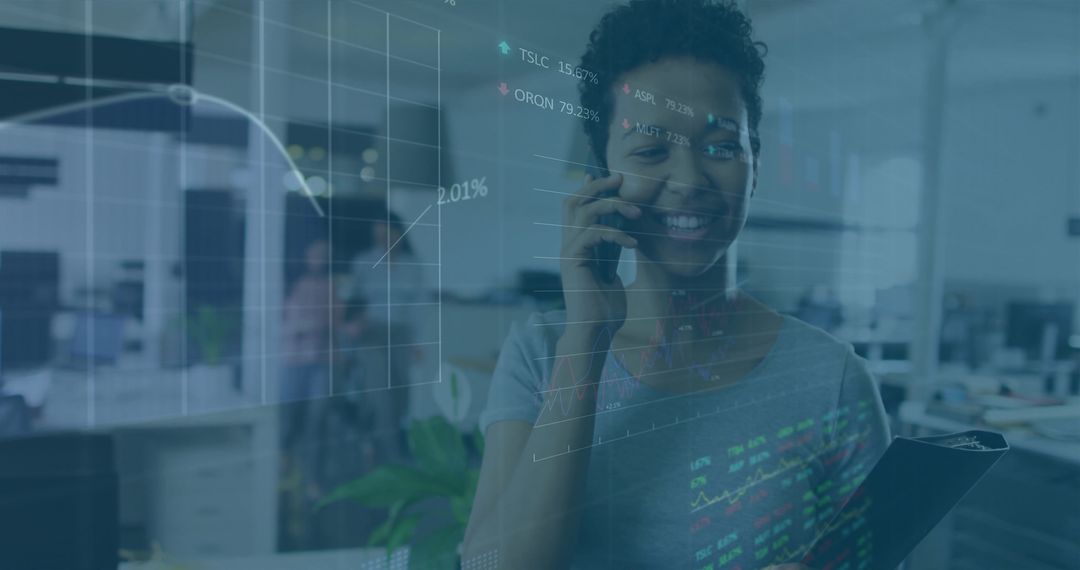 Smiling professional using phone and clipboard with financial data overlays in office