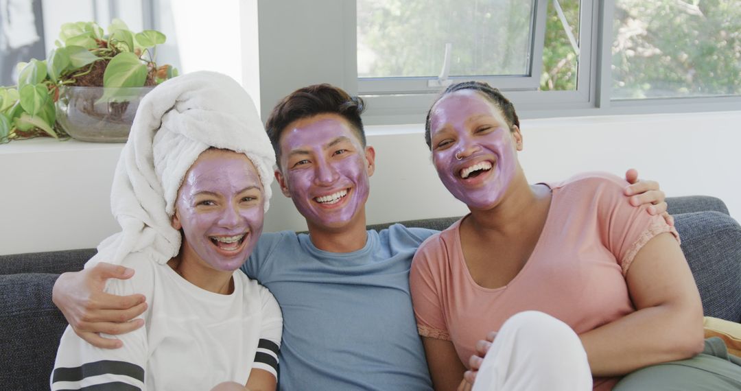 Friends Enjoying Home Spa Day with Laughter and Face Masks