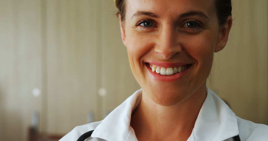 Smiling Female Doctor with Stethoscope in a Medical Facility - Free Images, Stock Photos and Pictures on Pikwizard.com