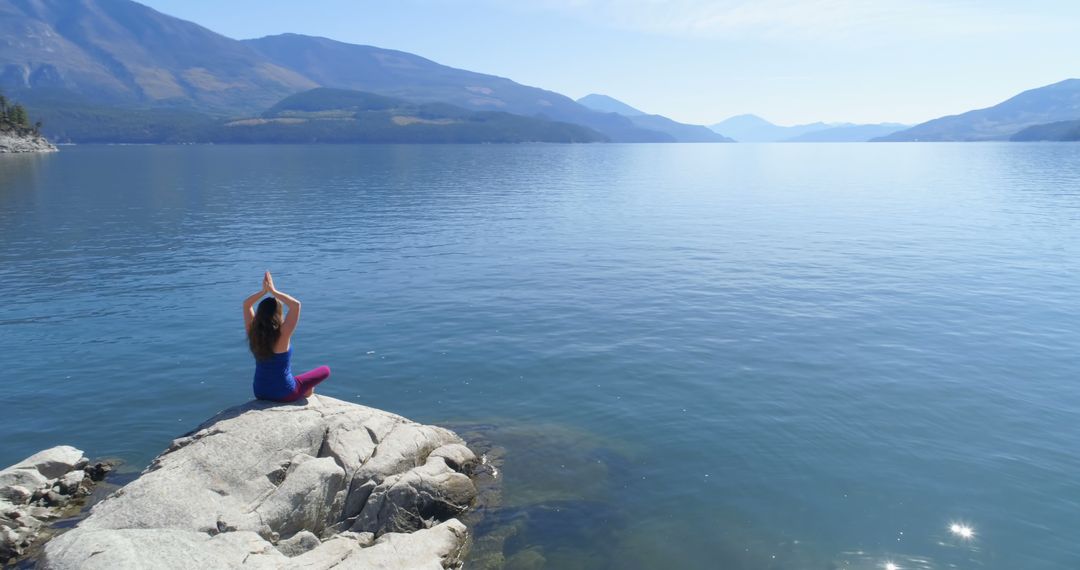 Serene Meditation by Mountain Lake - Free Images, Stock Photos and Pictures on Pikwizard.com