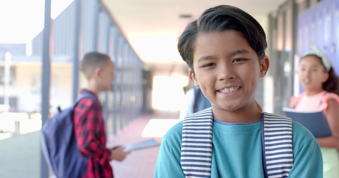 Smiling Biracial Boy in School Corridor Ready for Learning