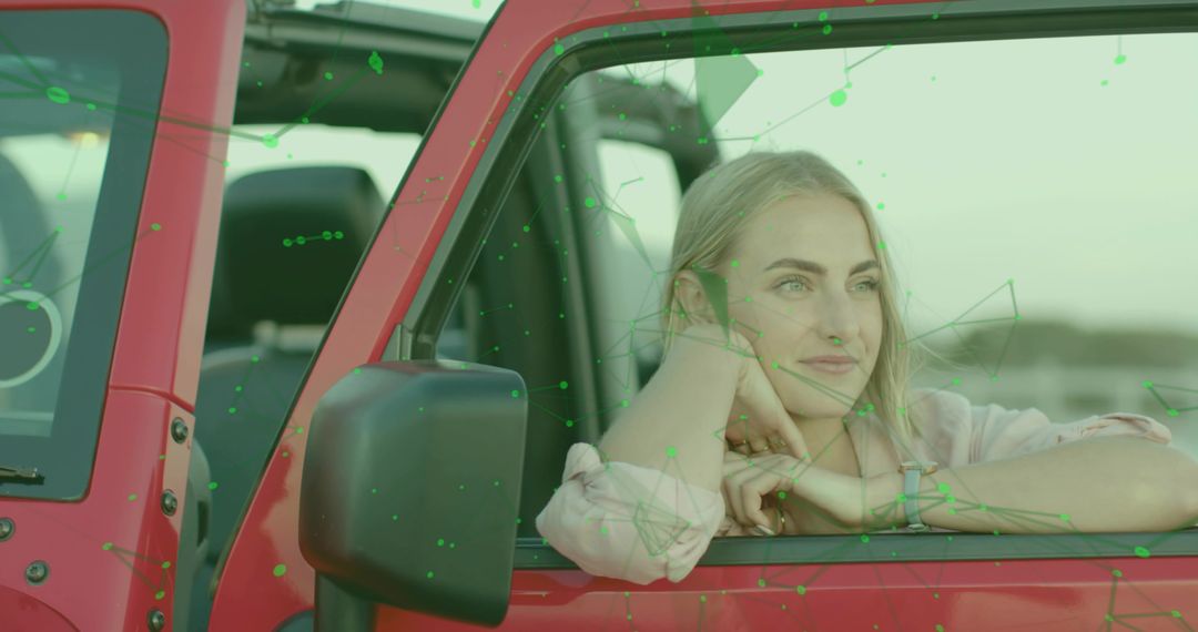 Smiling Woman Relaxing in Red Off-Road Vehicle by Lake