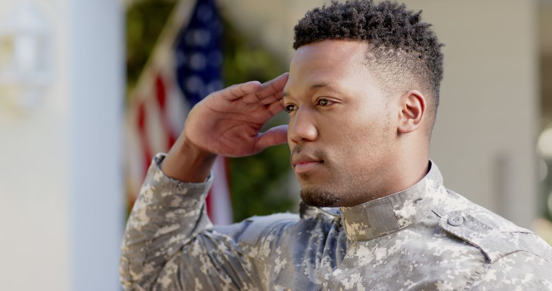 Proud African American Soldier Saluting at Home - Free Images, Stock Photos and Pictures on Pikwizard.com