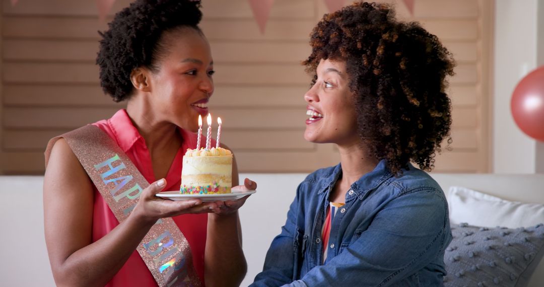 Joyful Celebration Young Women Sharing Birthday Cake Together