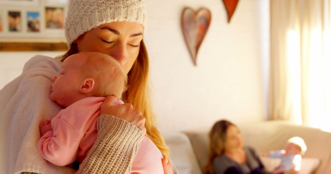 Young Mother Embracing Newborn Baby In Cozy Living Room - Free Images, Stock Photos and Pictures on Pikwizard.com