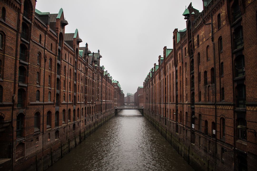 Misty View of Historical Canal in Brick Warehouse District - Free Images, Stock Photos and Pictures on Pikwizard.com