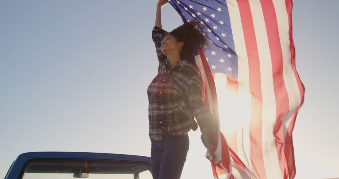 Young Woman Waving American Flag from Car at Sunset - Free Images, Stock Photos and Pictures on Pikwizard.com