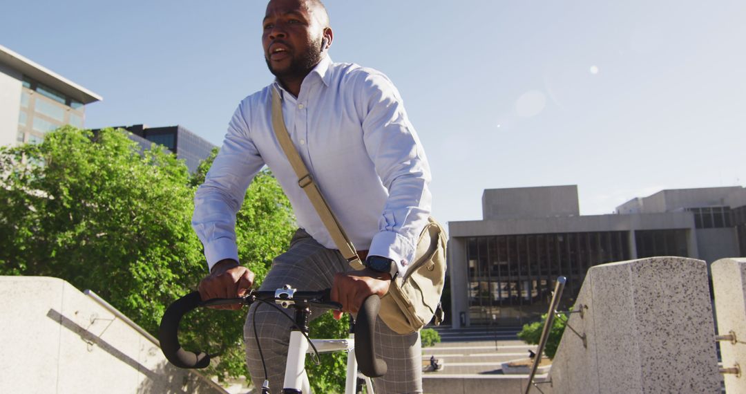 Man Commuting on Bicycle in Urban Environment