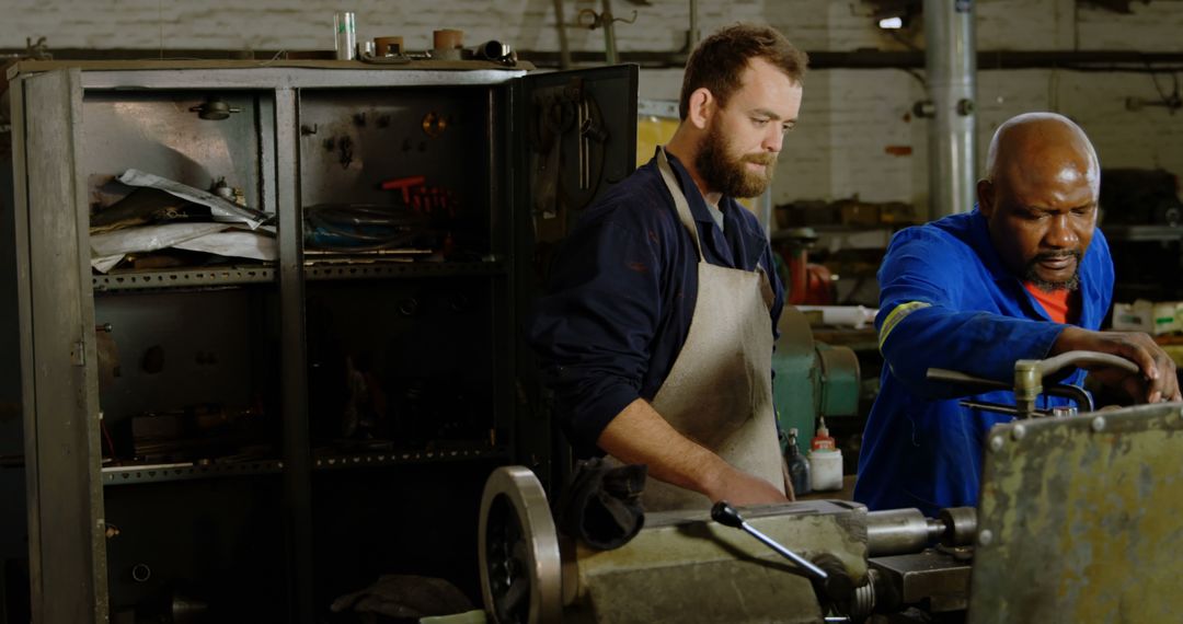 Two Skilled Machinists Working Together in Industrial Workshop - Free Images, Stock Photos and Pictures on Pikwizard.com