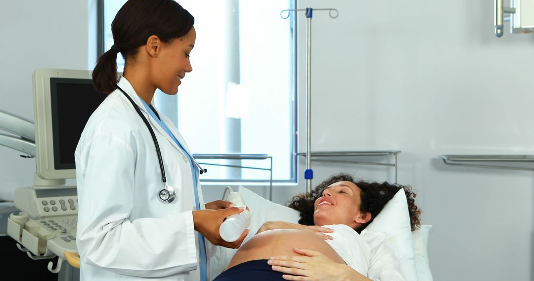 Doctor Treating Pregnant Woman in Hospital - Free Images, Stock Photos and Pictures on Pikwizard.com