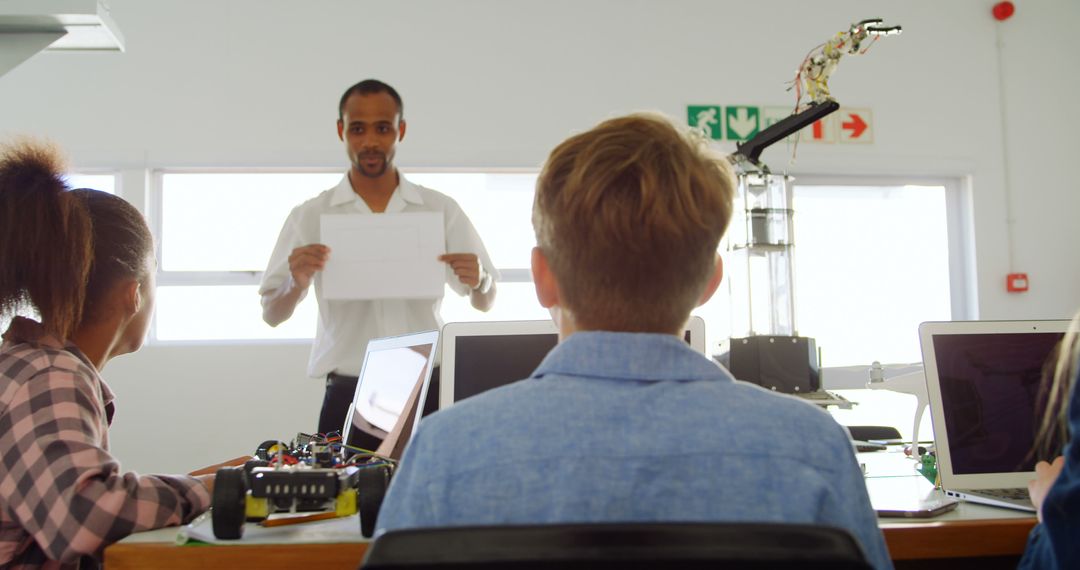 Teacher Instructing Students with Robotics in Classroom - Free Images, Stock Photos and Pictures on Pikwizard.com