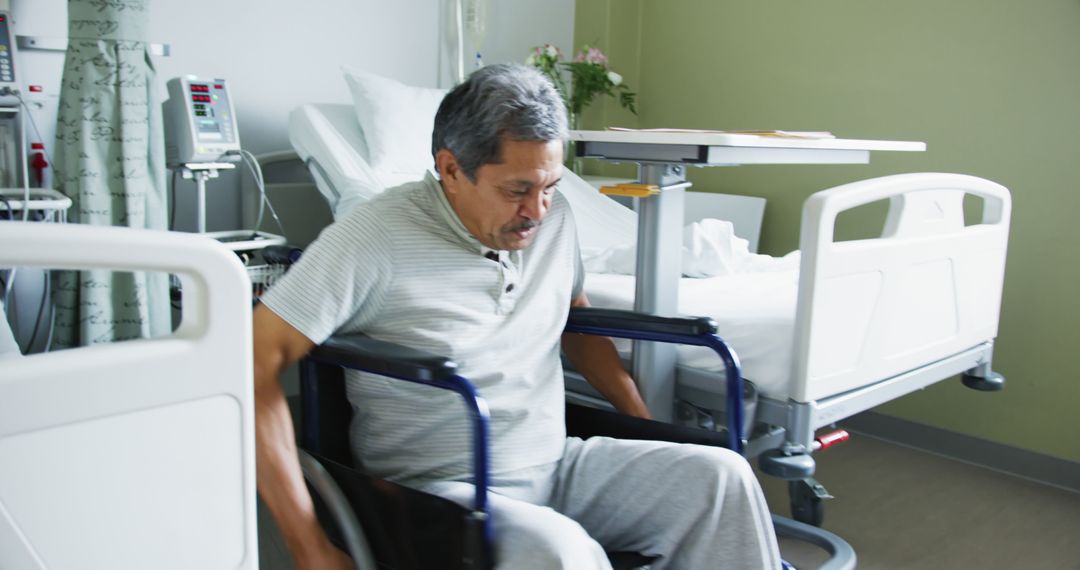 Elderly Man Transitioning from Wheelchair to Hospital Bed - Free Images, Stock Photos and Pictures on Pikwizard.com