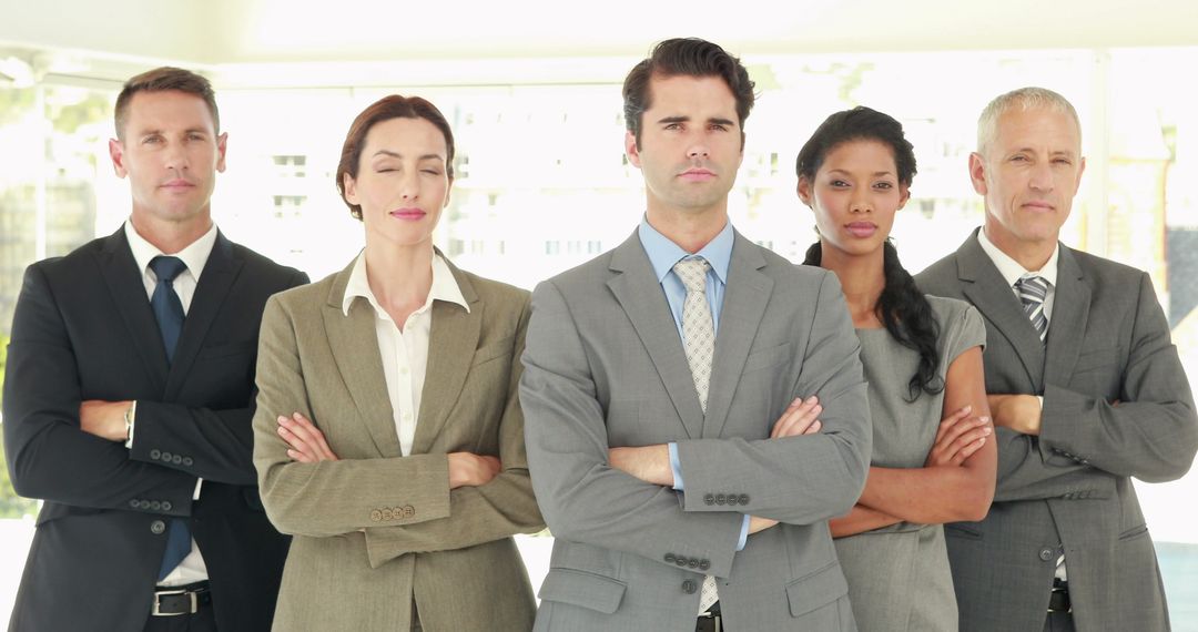 Confident Business Team Standing Together with Arms Crossed