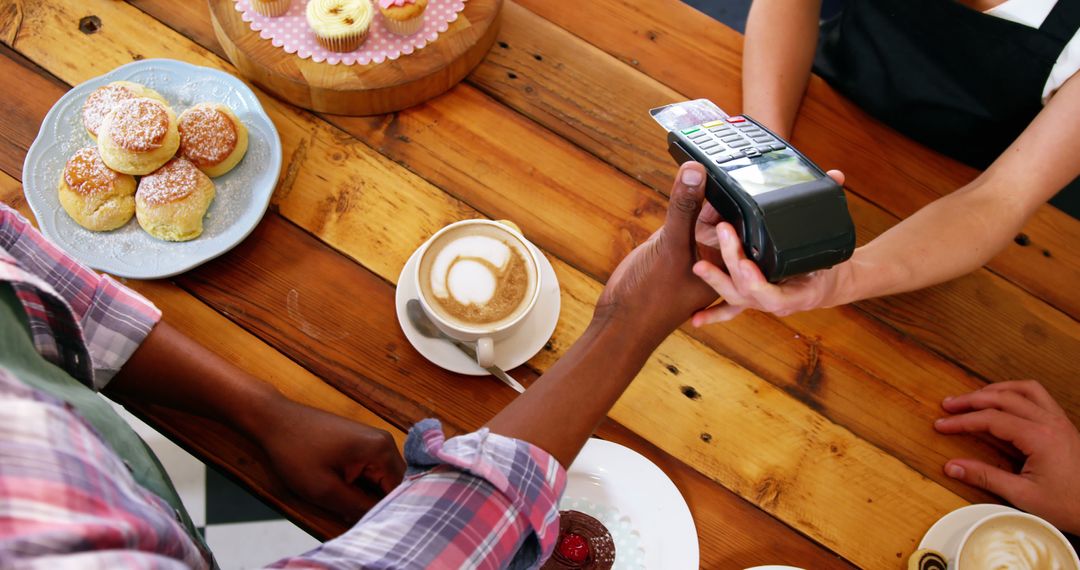 Customer using contactless payment in bakery cafe - Free Images, Stock Photos and Pictures on Pikwizard.com