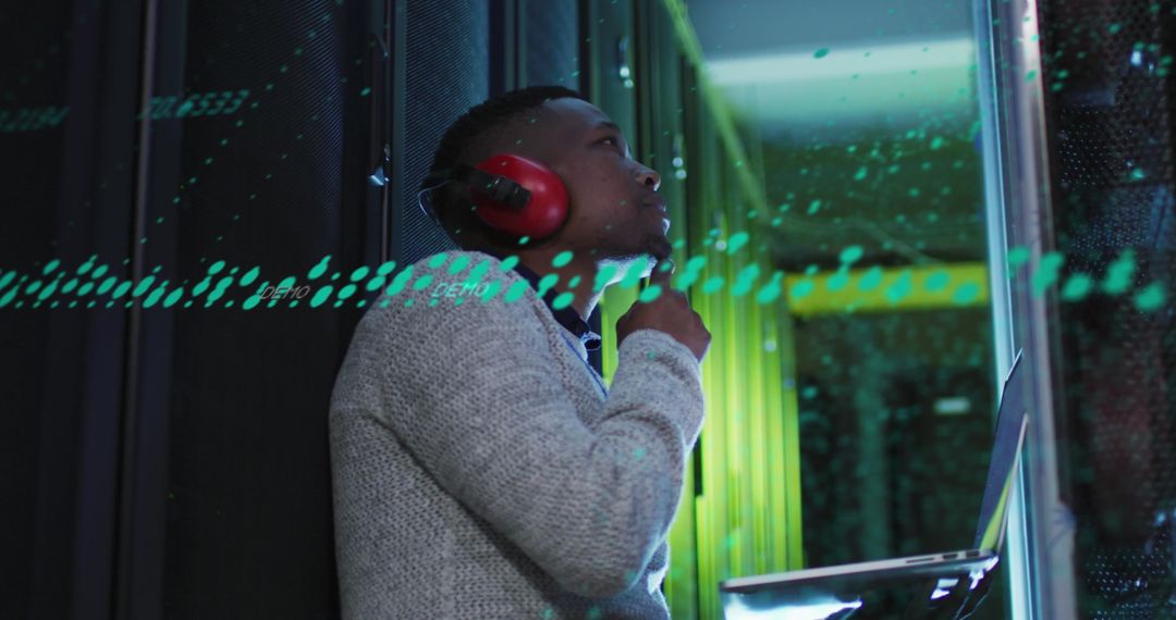 Thoughtful Engineer Analyzing Data in Modern Server Room