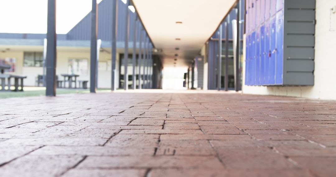 Student Feet Walking Through School Corridor Focused on Paved Path