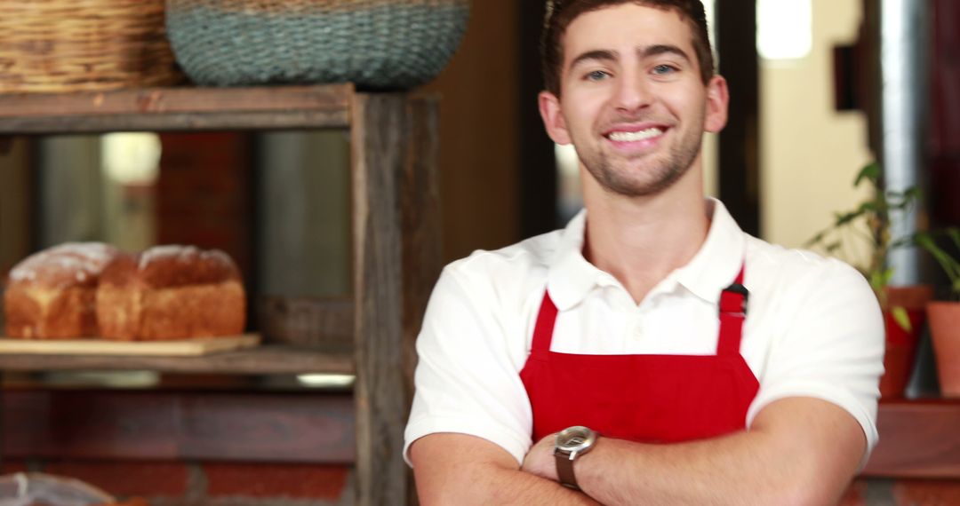 Friendly Young Male Baker Smiling in Bakery - Free Images, Stock Photos and Pictures on Pikwizard.com