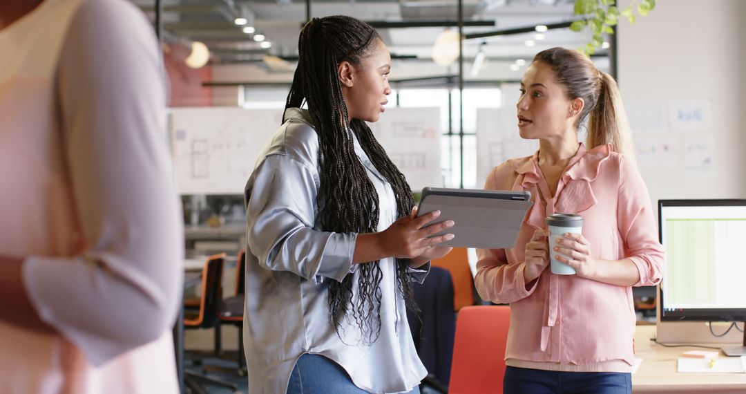 Collaborative Diverse Colleagues Discussing in Modern Office