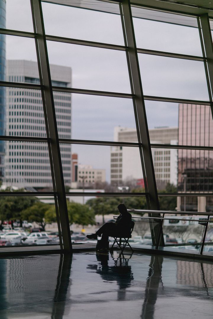 Person Silhouetted Against Tall Office Buildings - Free Images, Stock Photos and Pictures on Pikwizard.com