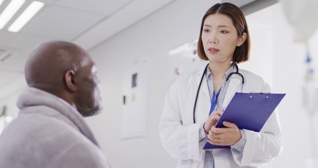 Female Doctor Discussing Health with Elderly Male Patient - Free Images, Stock Photos and Pictures on Pikwizard.com